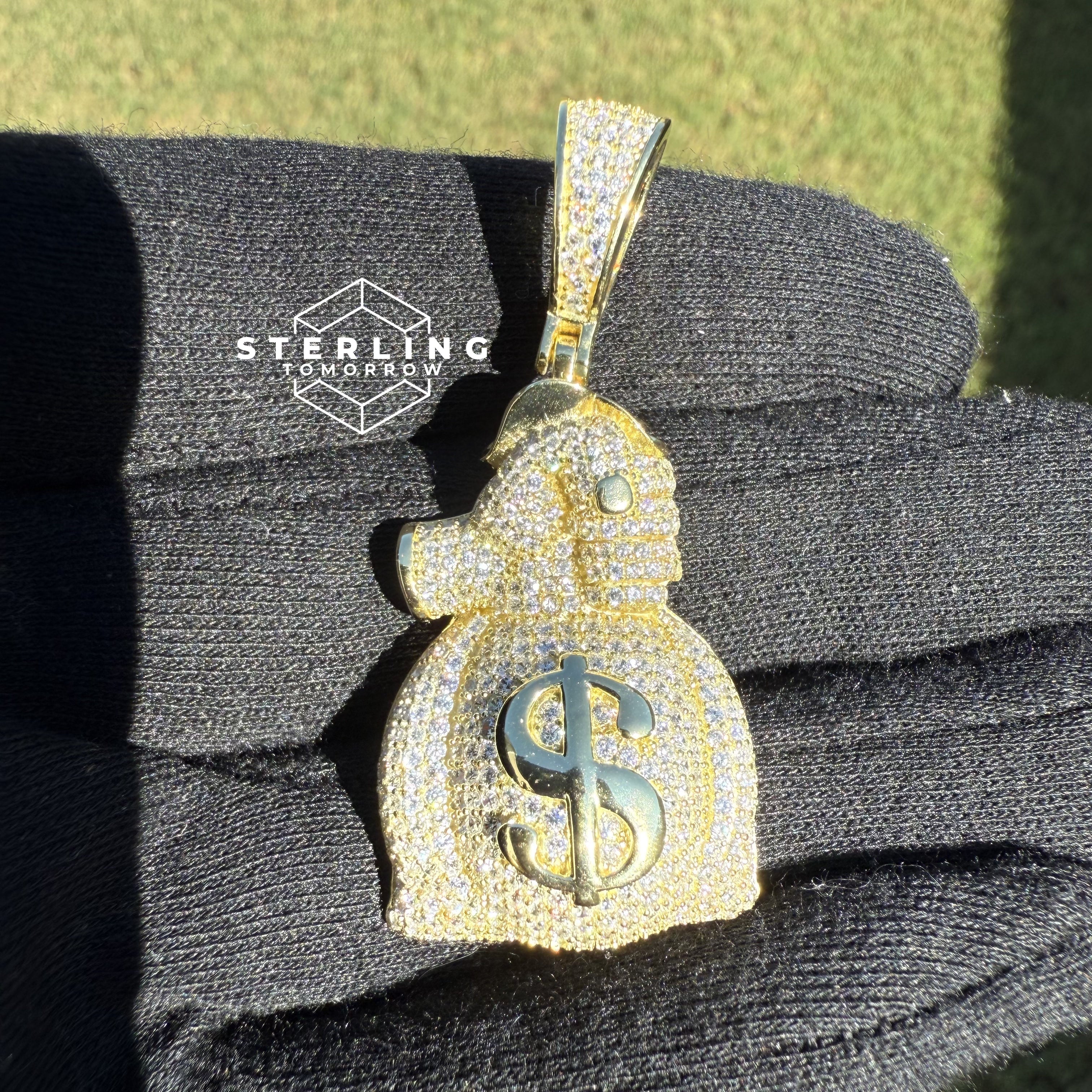Gripping Moneybag Gold Tone CZ Pendant