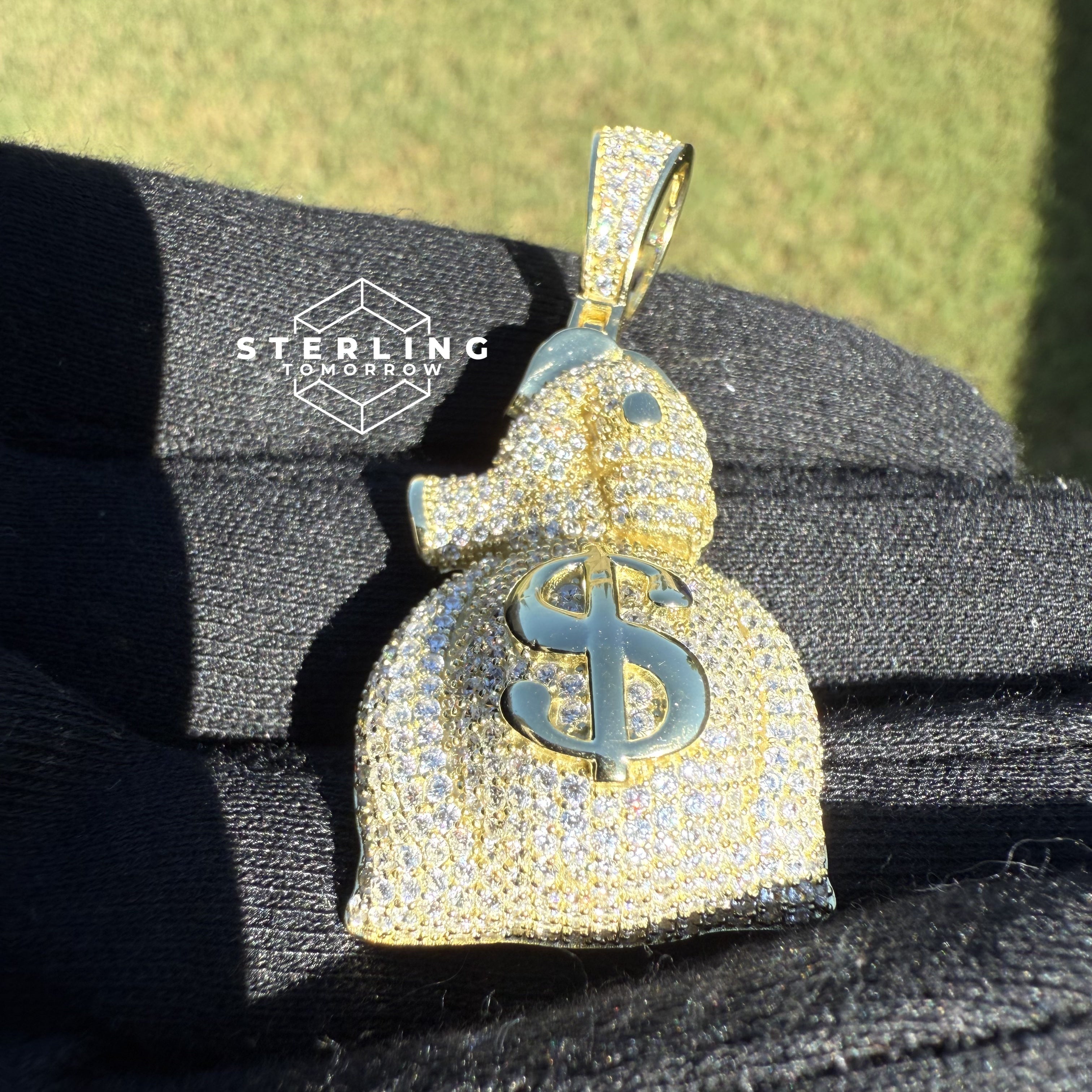 Gripping Moneybag Gold Tone CZ Pendant