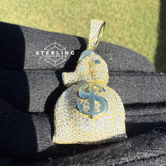 Gripping Moneybag Gold Tone CZ Pendant