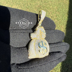 Gripping Moneybag Gold Tone CZ Pendant