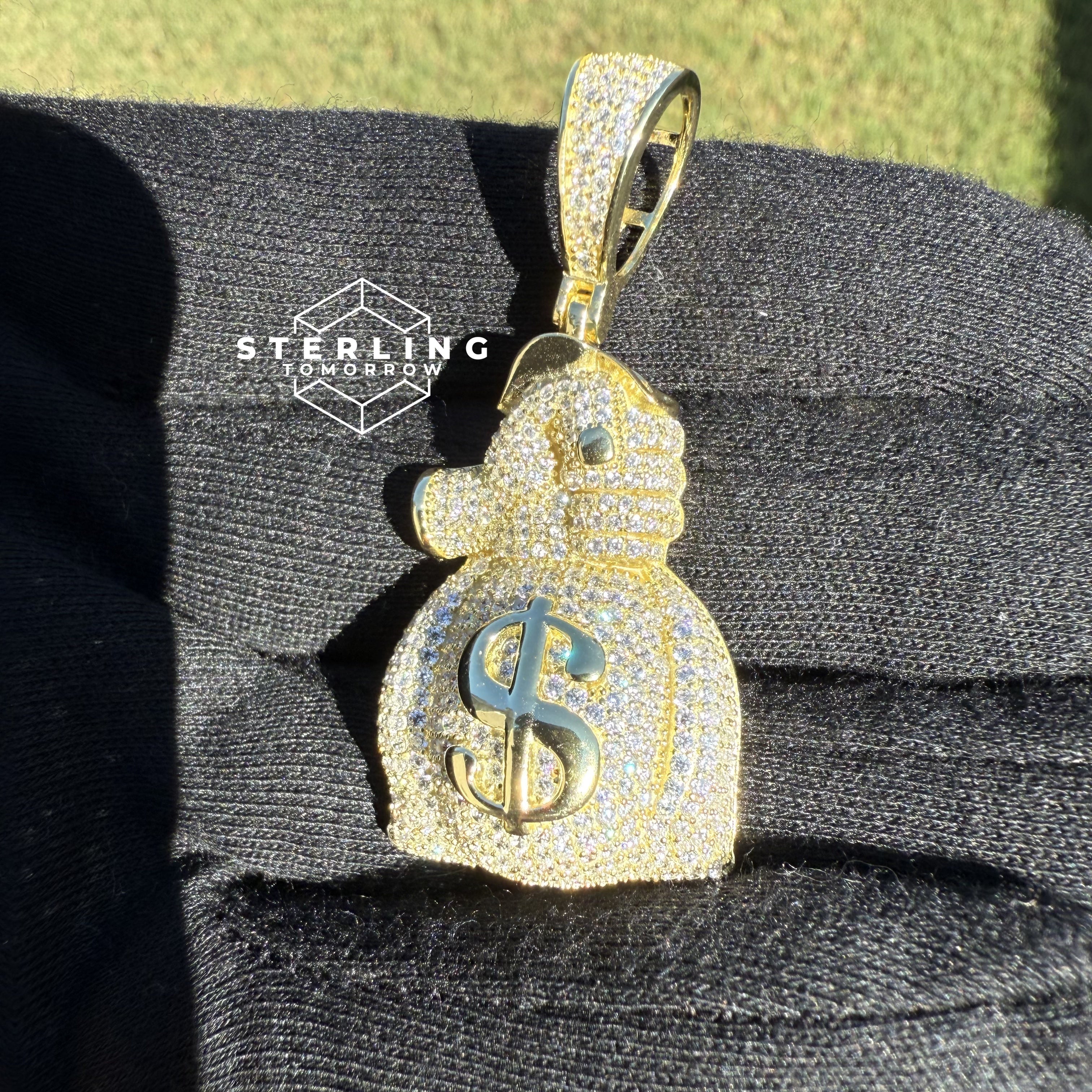 Gripping Moneybag Gold Tone CZ Pendant