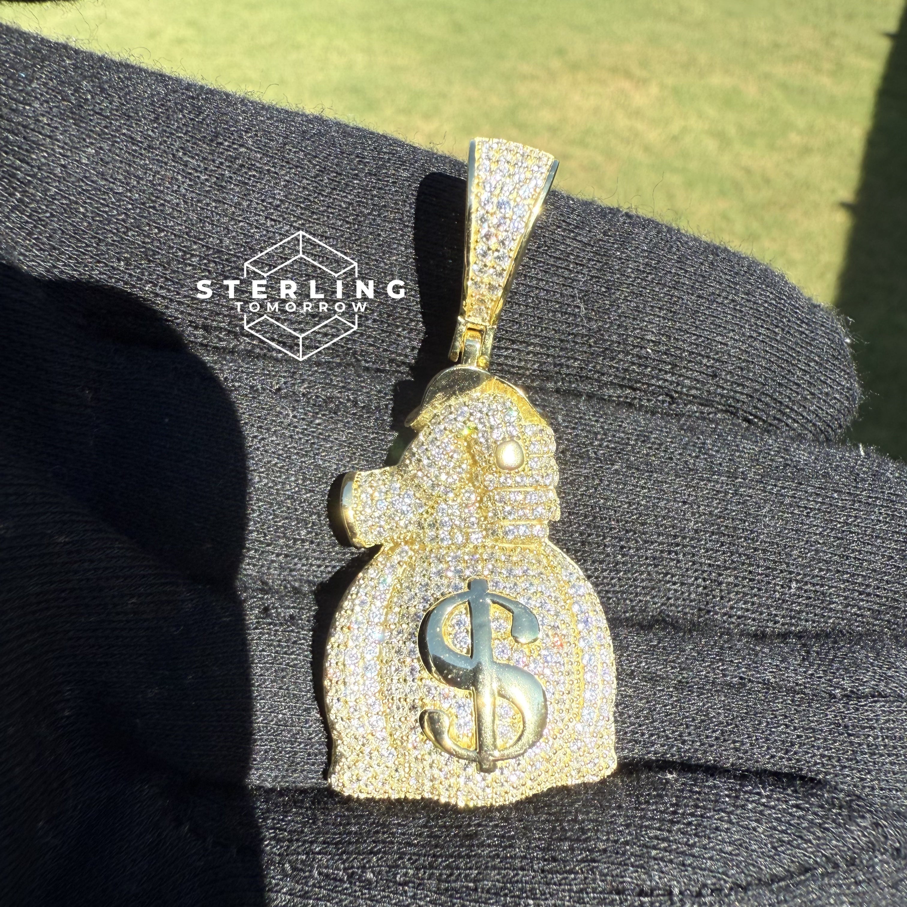 Gripping Moneybag Gold Tone CZ Pendant