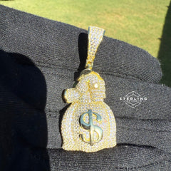 Gripping Moneybag Gold Tone CZ Pendant